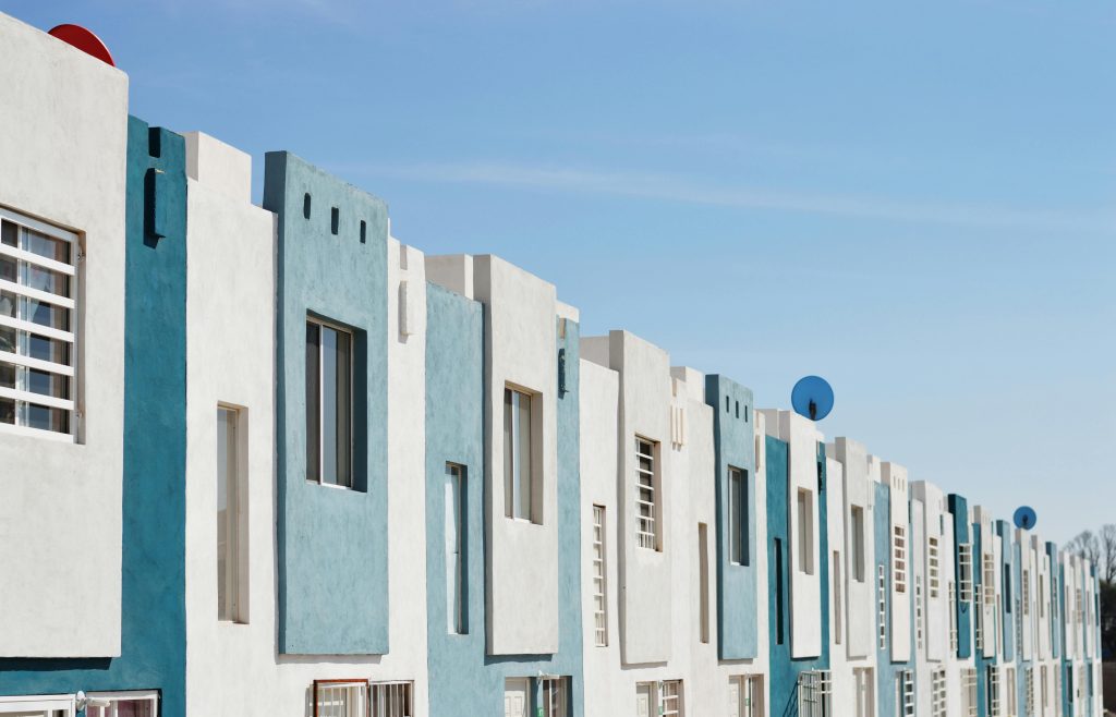geometric blue and white facade of a modern apartment building under a clear sky hwwxwjxcg sbqdwh2f6l5a